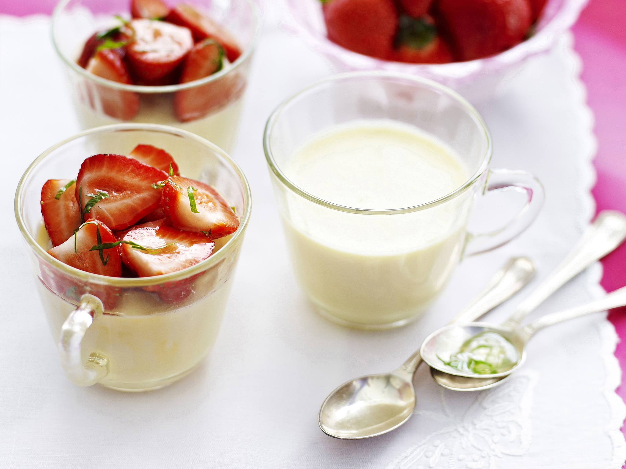 Panna cotta with strawberries with lemon basil syrup