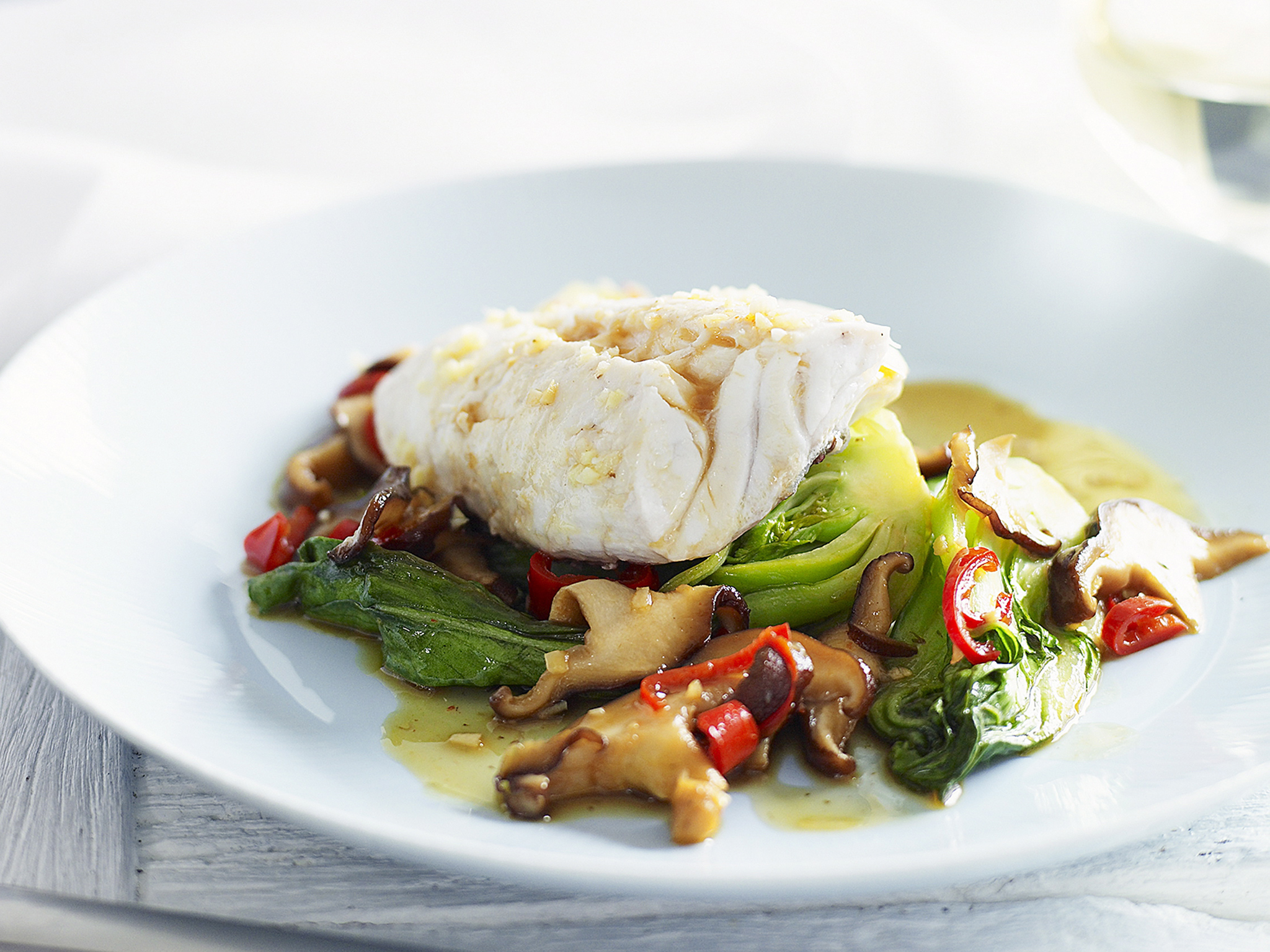 Steamed fish with bok choy and mushrooms