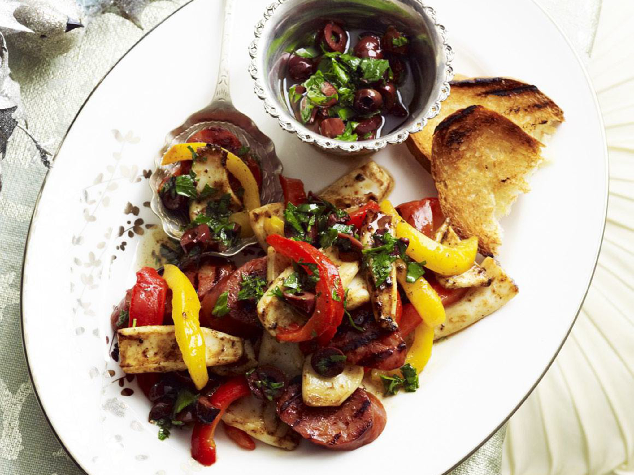 Barbecued squid and chorizo with black olive and parsley dressing