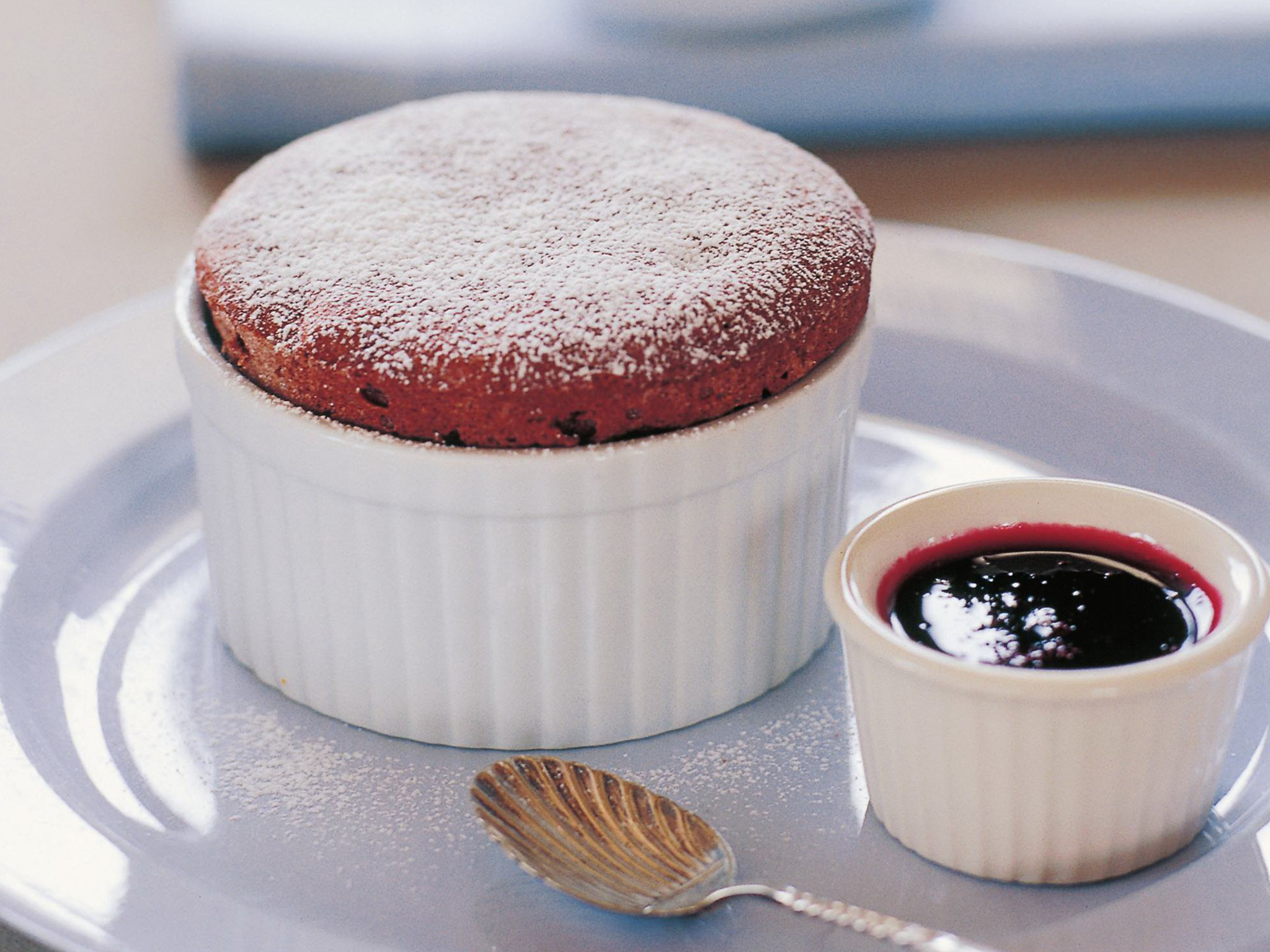 Chocolate soufflé with raspberry coulis