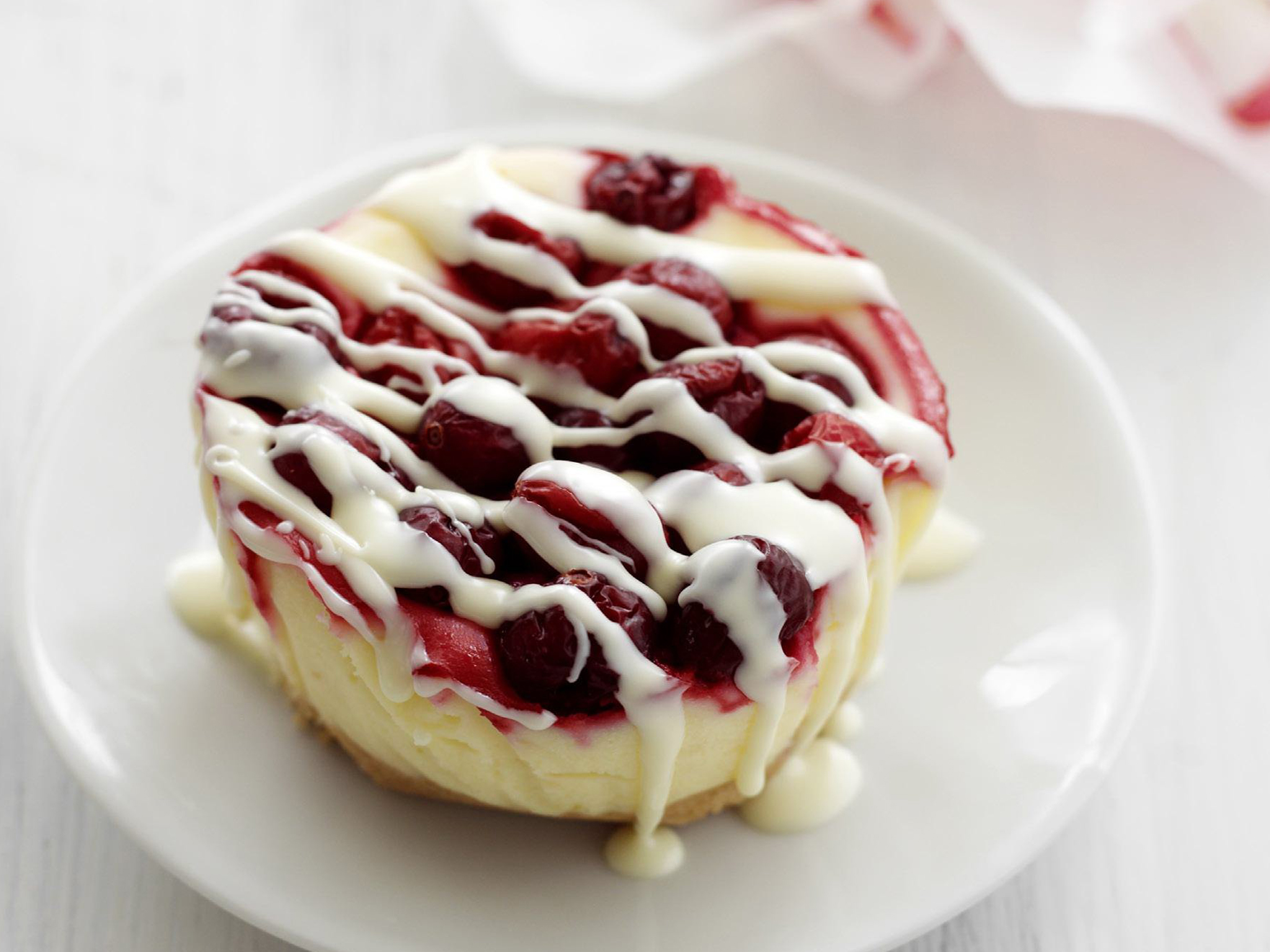 white chocolate and cranberry cheesecakes