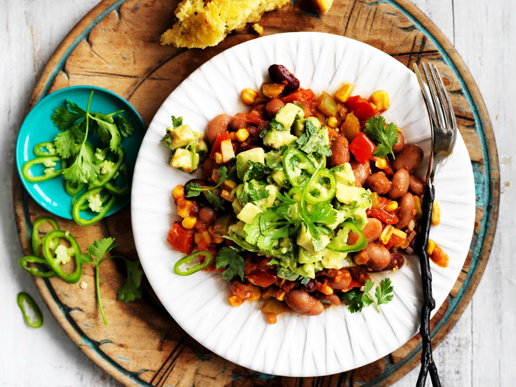 mexican beans with cornbread and avocado salsa