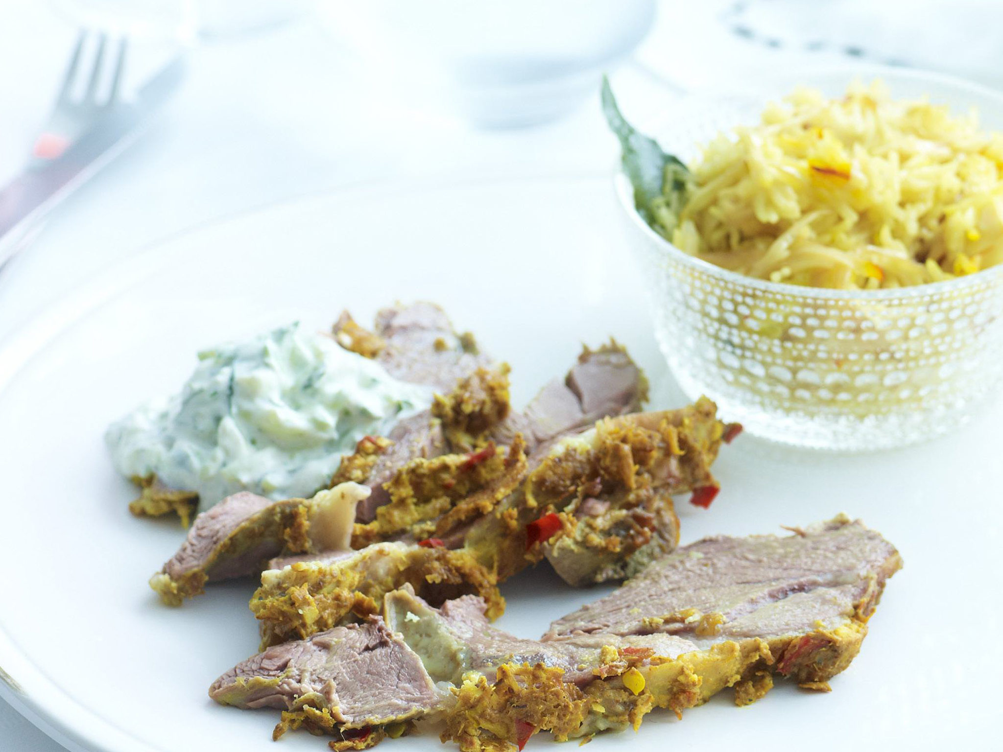 indian-spiced lamb with fried onion pilaf and raita