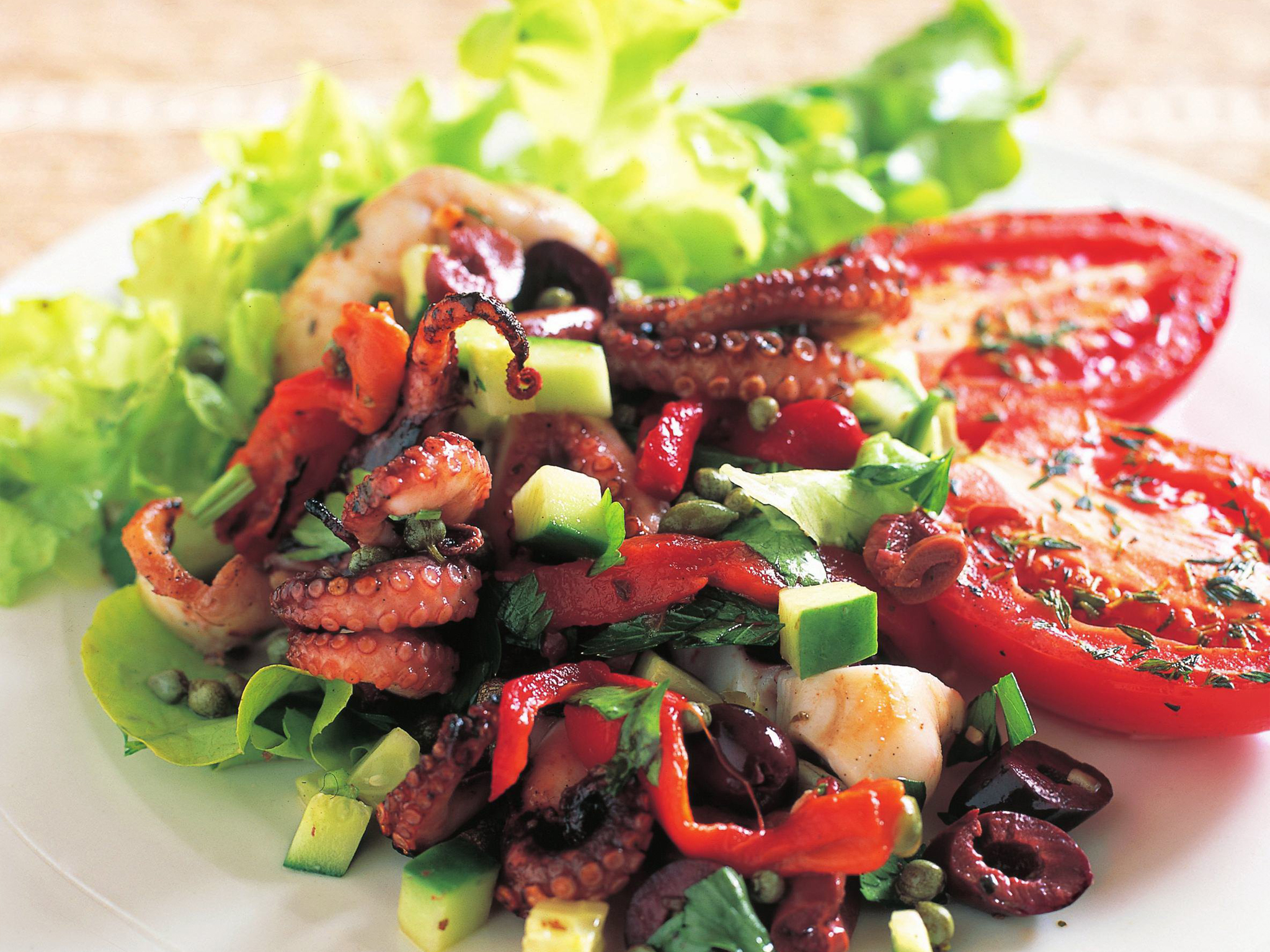 Mediterranean octopus salad with grilled tomatoes
