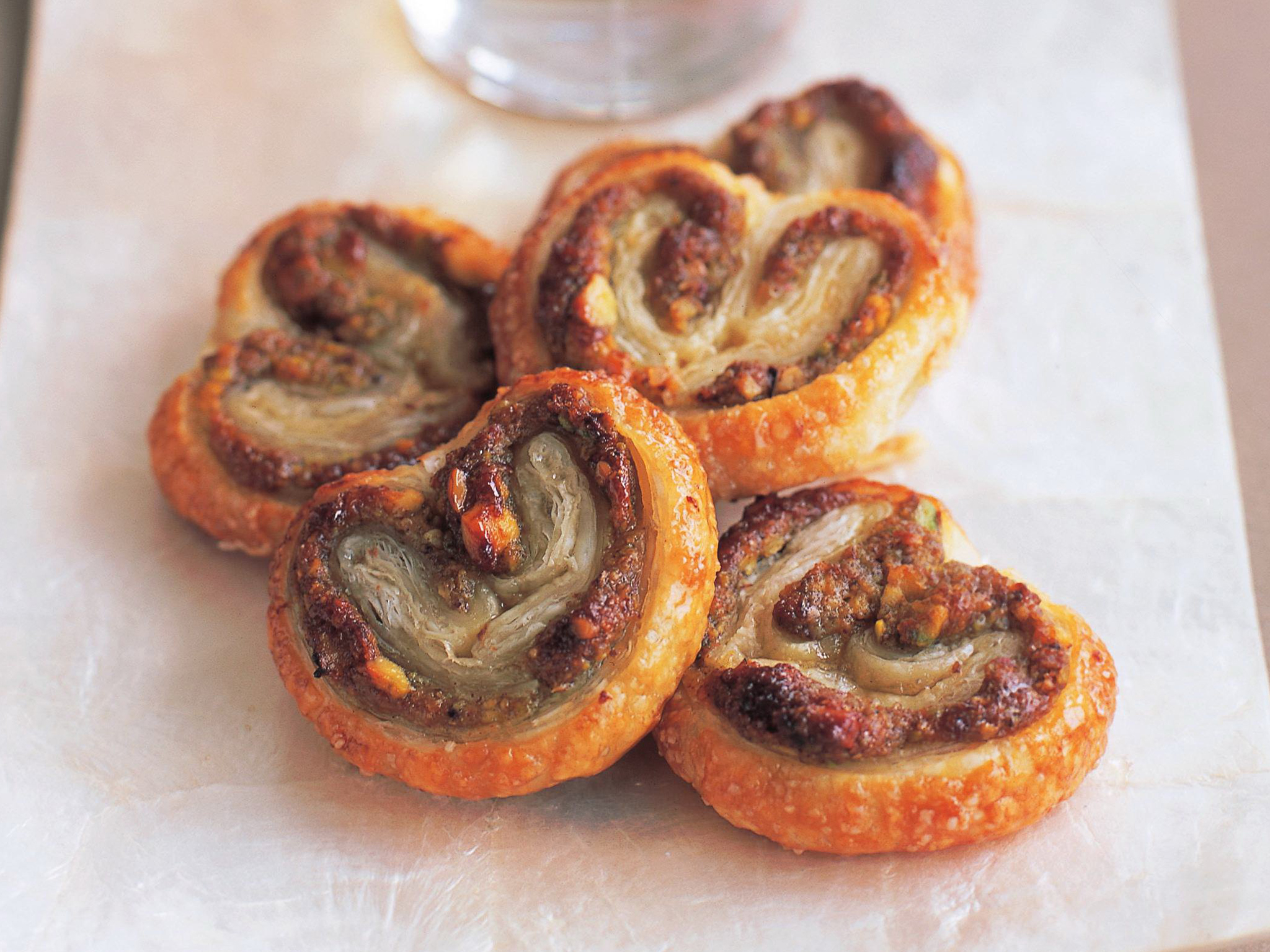 Honey-coated pistachio and rosewater palmiers