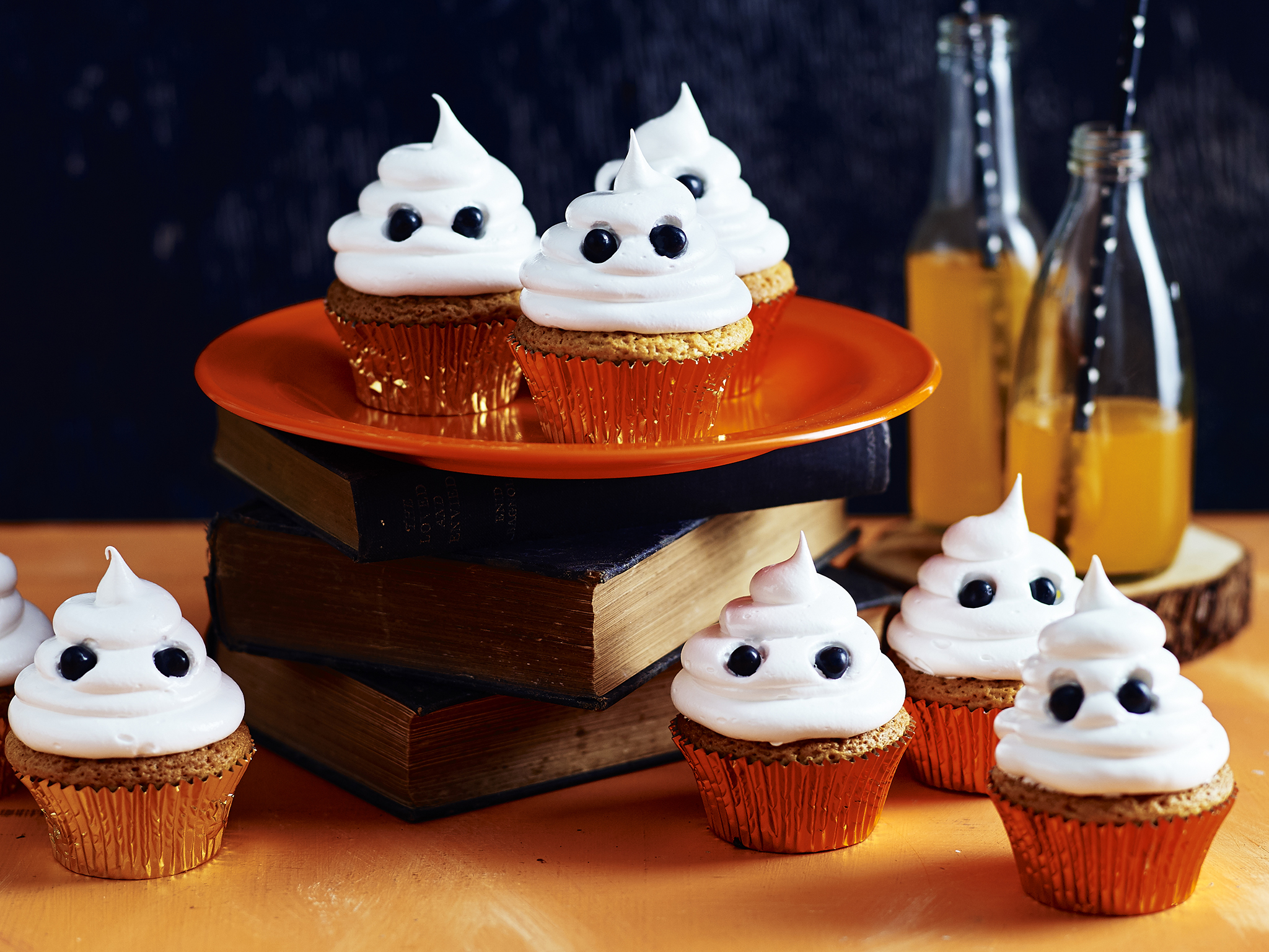 Halloween white chocolate ghost cupcakes with fluffy meringue icing