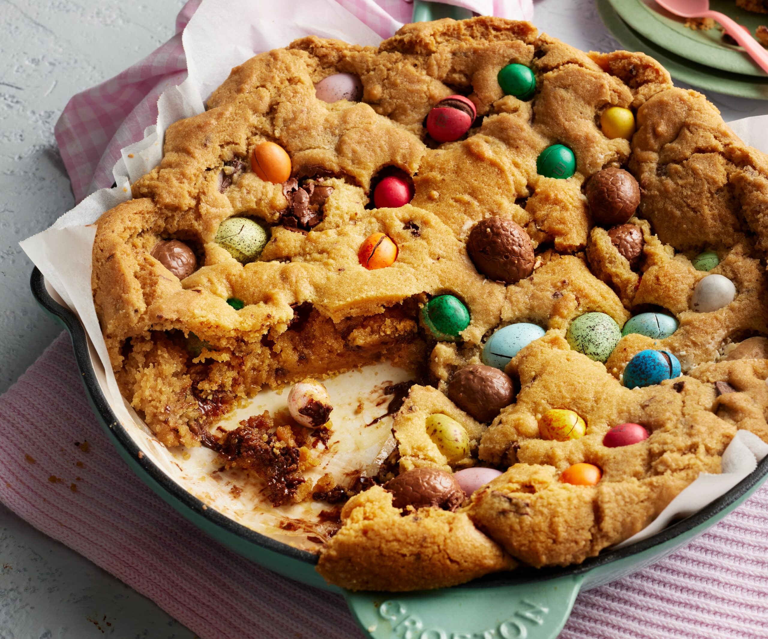 Cookie in the shape of a pie studded with Easter eggs