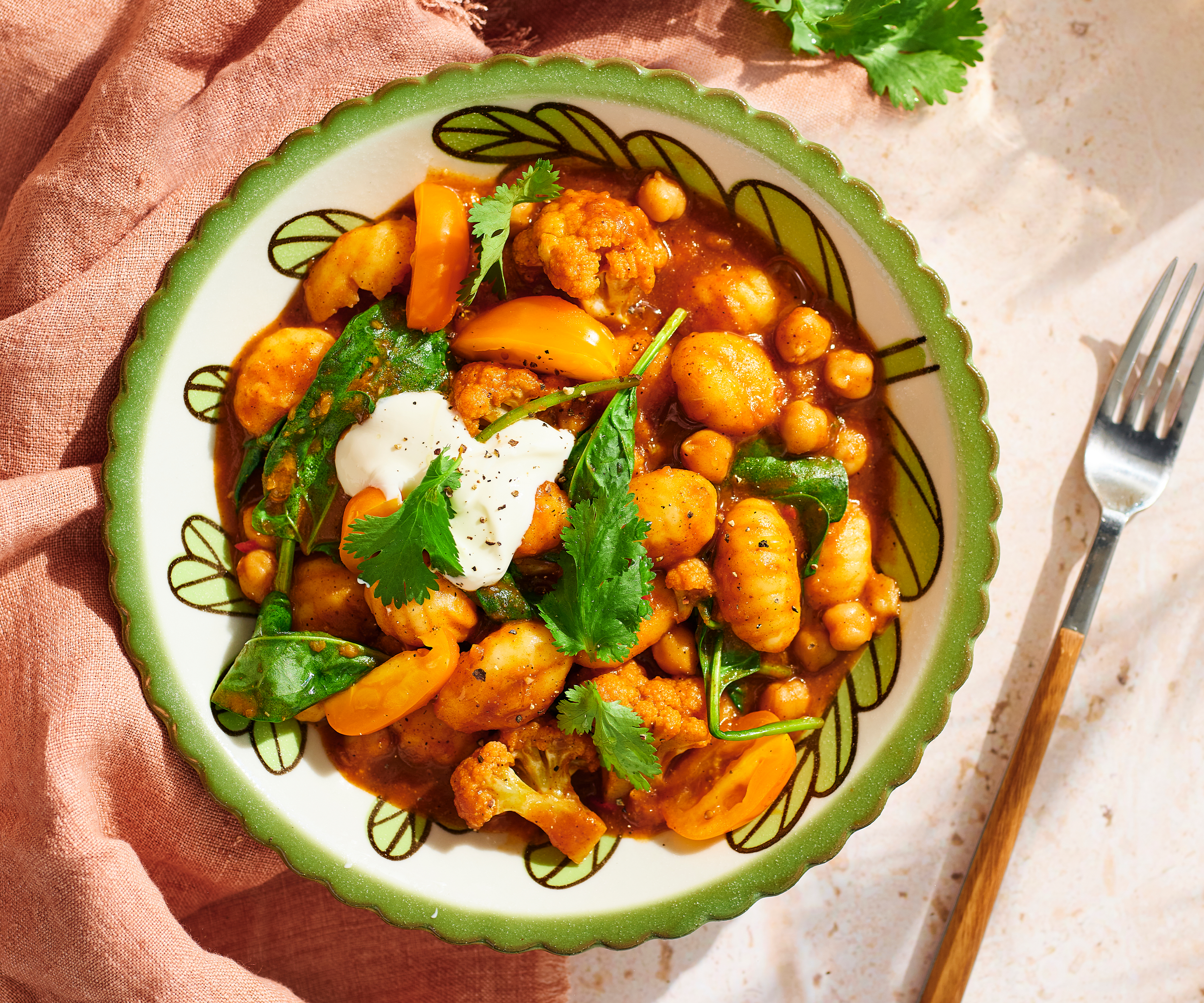 Bowl of chickpea, gnocchi & spinach curry