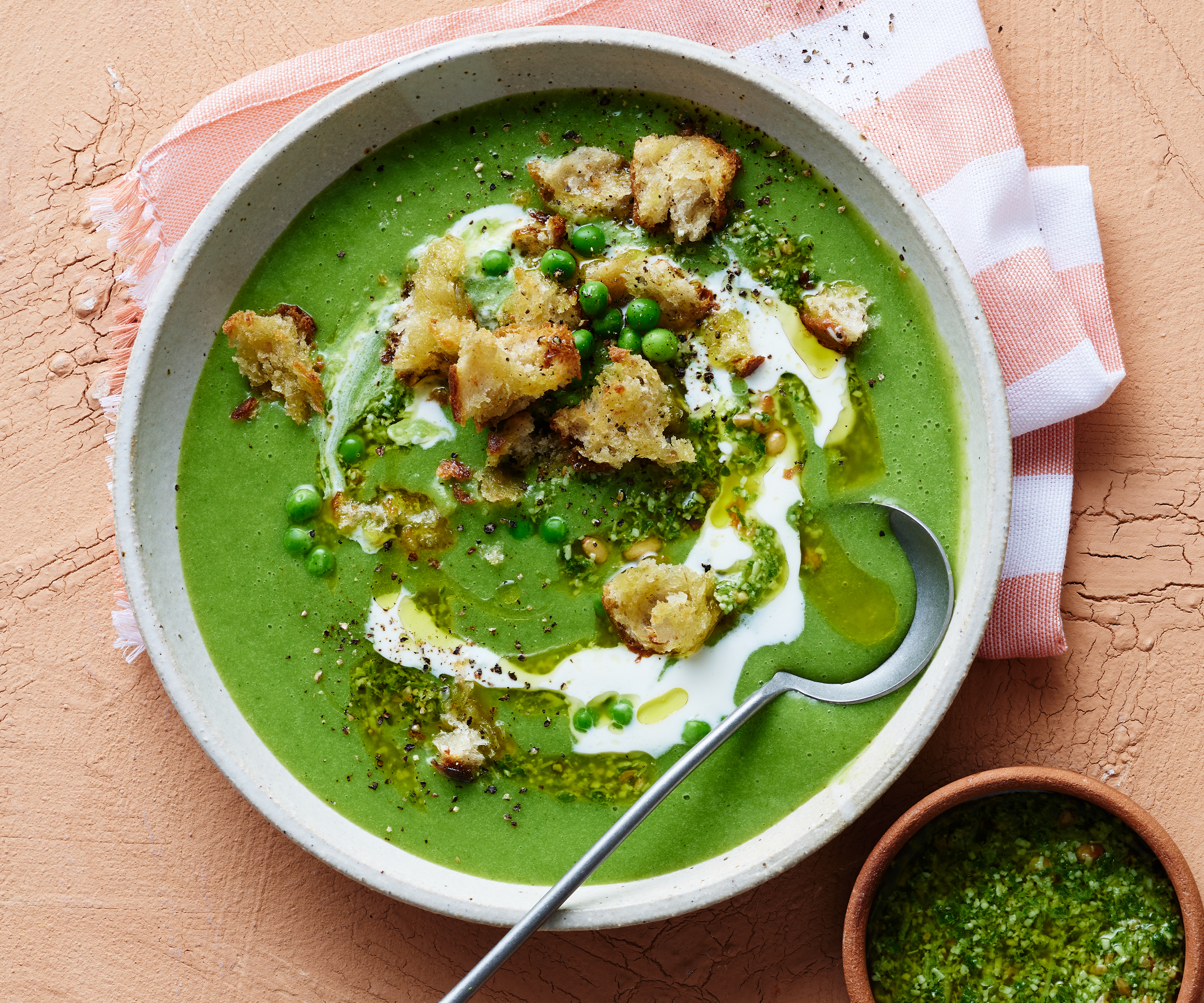 Potato and pea soup with pesto, ricotta cream and crispy croutons-image