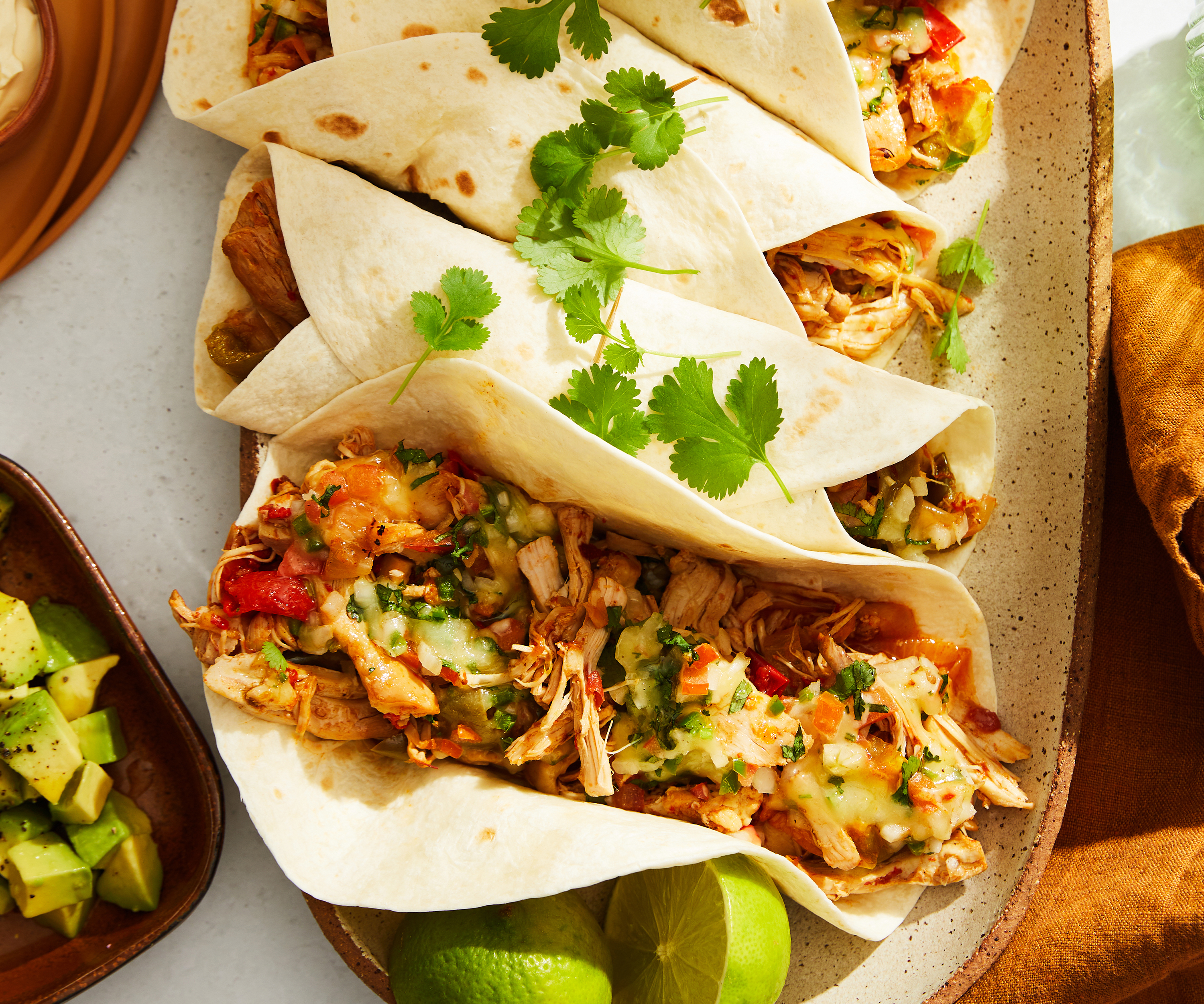 Pulled chicken fajitas with cheesy toppings