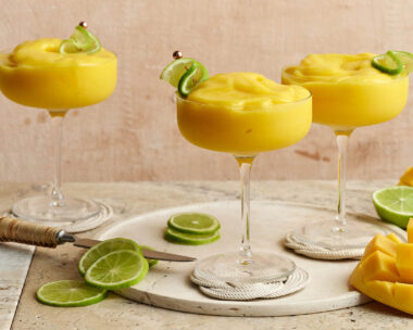 Three mango daiquiris in cocktail glasses