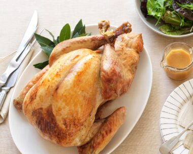 Turkey on oval platter on blonde background