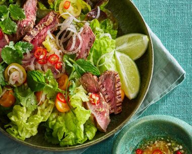 Thai beef salad plus sauce in a bowl