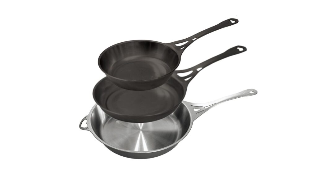 A set of pans from Solidteknics, featuring two cast iron frypans and one stainless steel frypan