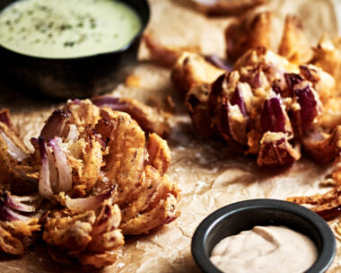Blooming onions with warm cider cheese sauce and creamy tomato and horseradish sauce