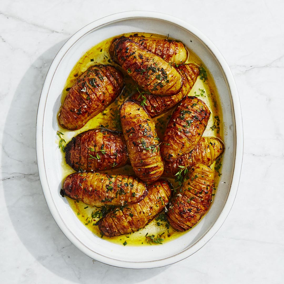 Hasselback potatoes with chive & thyme butter